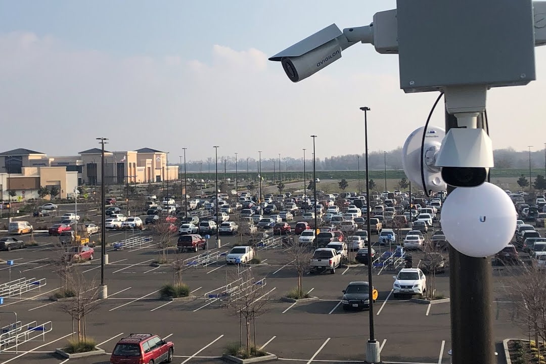 Parking Lot Security Tampa parking lot safety for businesses with security cameras and lighting in a commercial parking lot